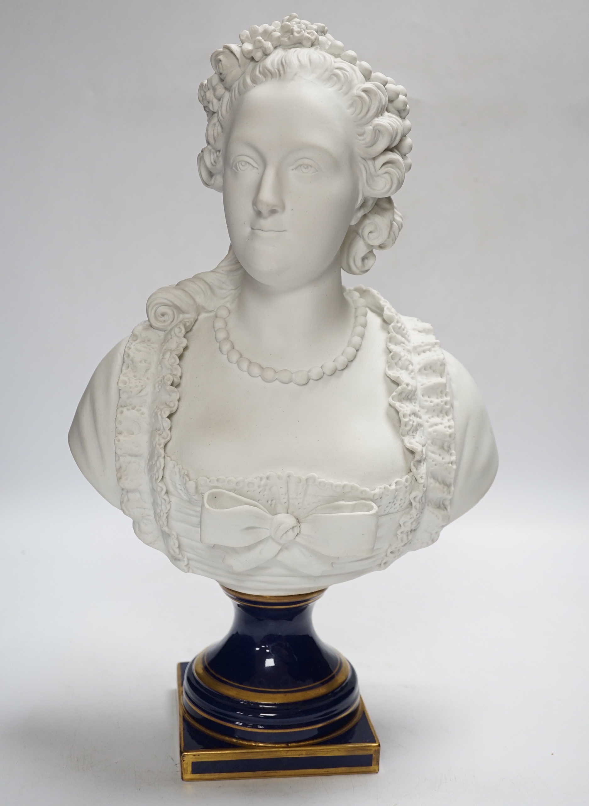 A Sevres style biscuit porcelain bust of a courtesan, 42cm high